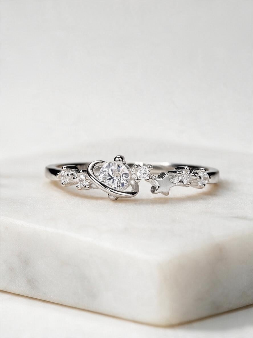 Anello regolabile con Saturno (argento 925)