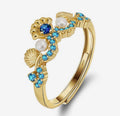 Anello regolabile con conchiglie (argento 925)
